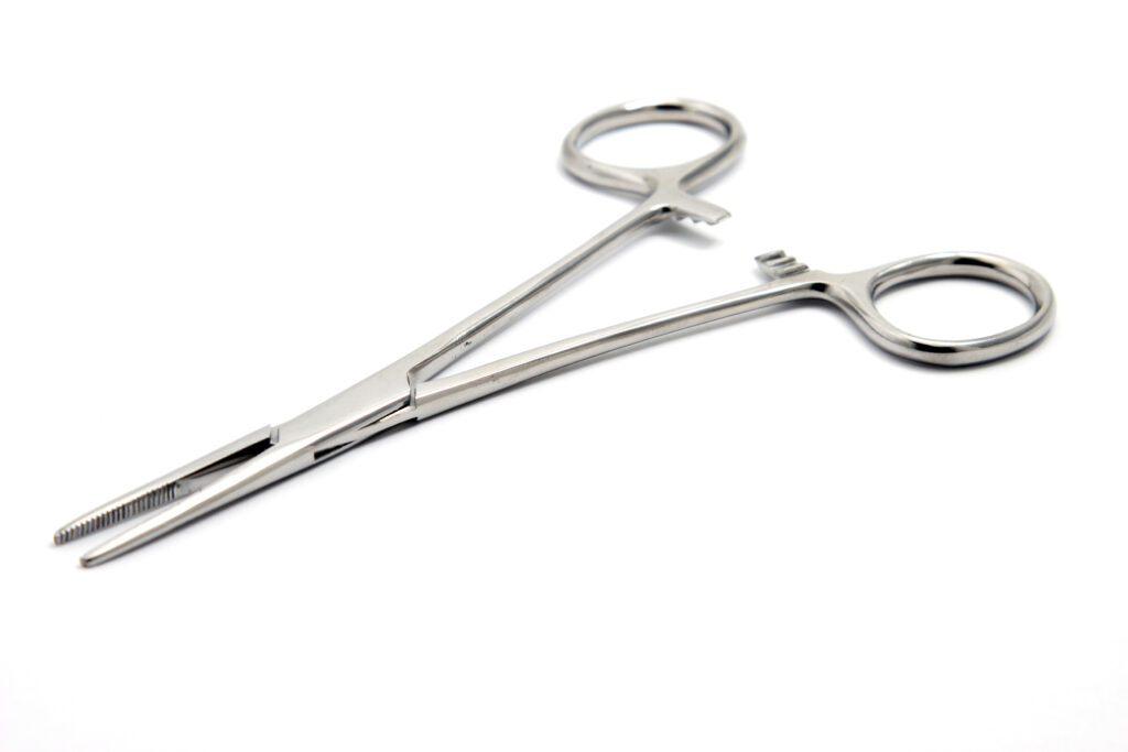 Medical Supplies isolated on a white background. Alligator clip, suture driver.